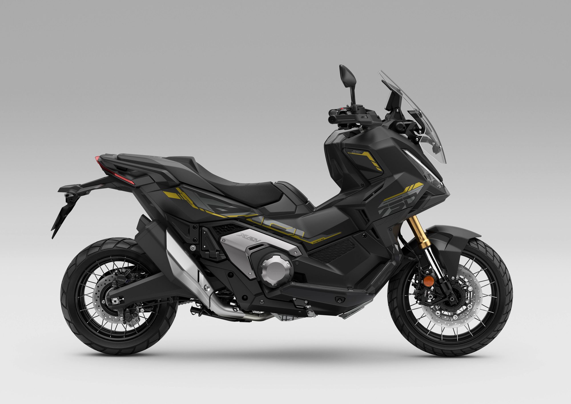 Perfil de la Honda X-ADV 2027 negra con detalles dorados